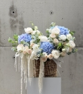 Basket with peonies, roses and astilba