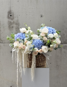 Basket with peonies, roses and astilba