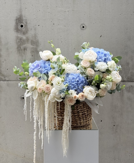 Basket with peonies, roses and astilba