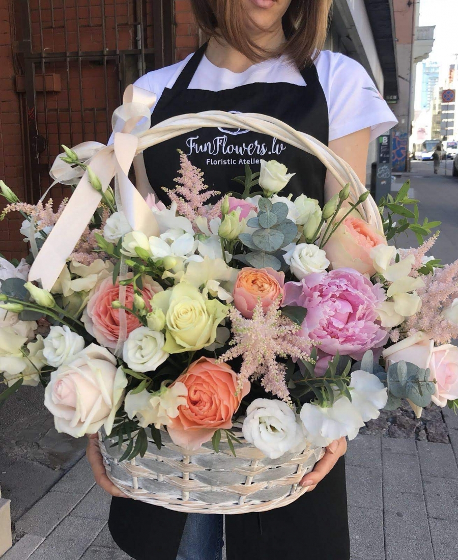 Basket with peonies, roses and astilba